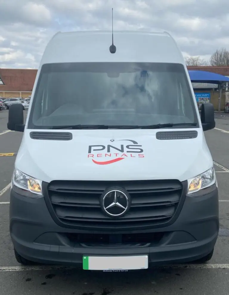 A white van with the name pns on it.