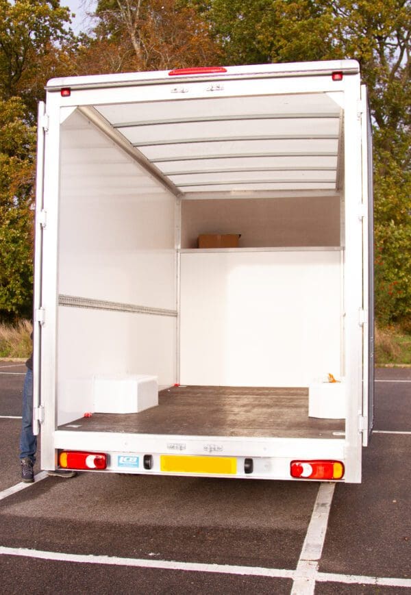 A white truck is parked in the parking lot.