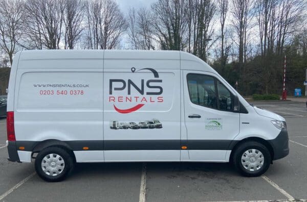 A white van with the pns logo on it.